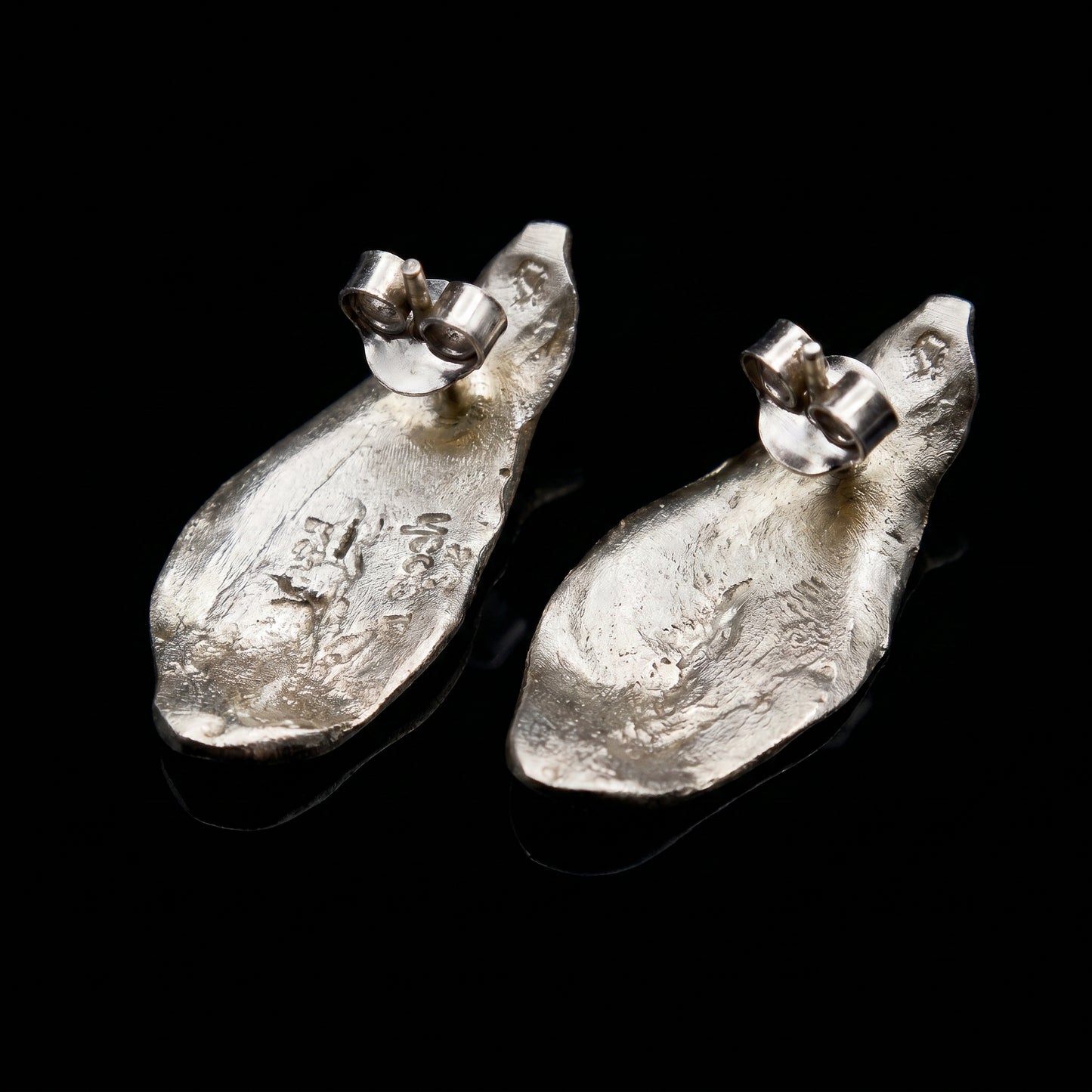 Textured teardrop silver drop earrings with small top post and clasp
