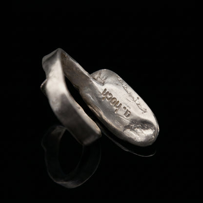 Silver-tone oval ring with stamped design on inner band