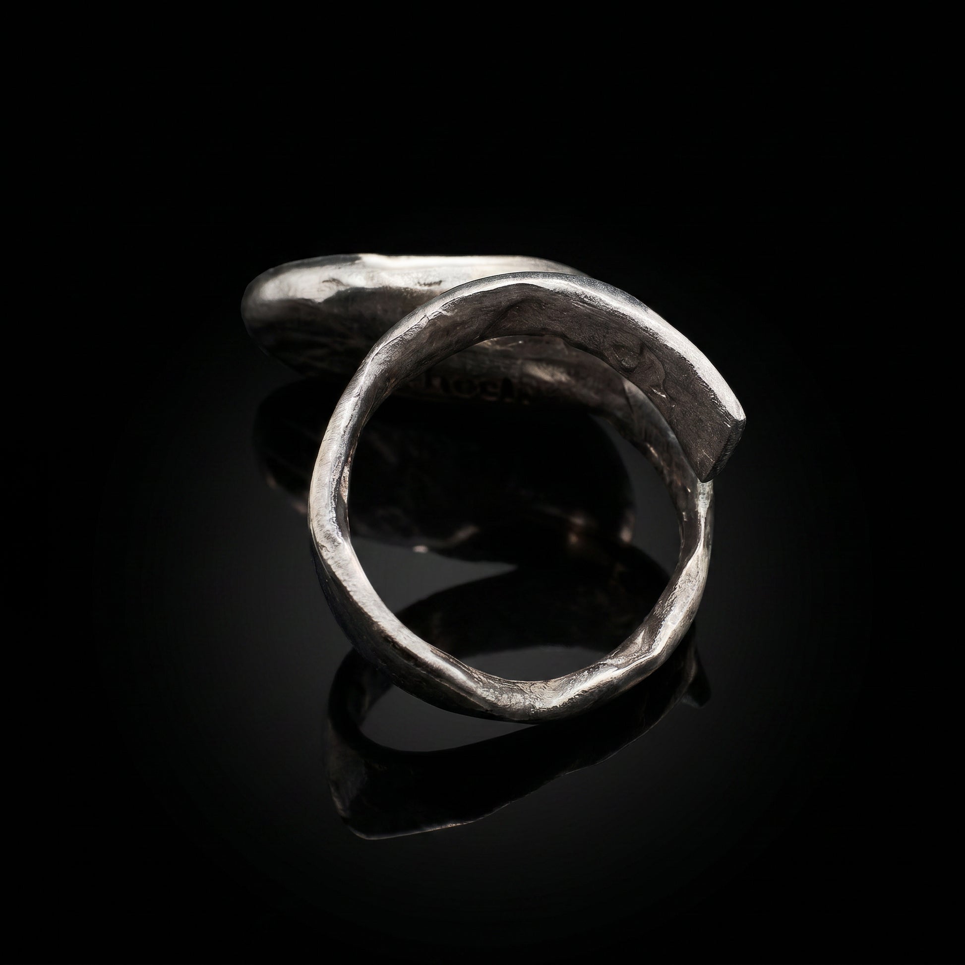 Silver-tone open oval ring band with curved silhouette
