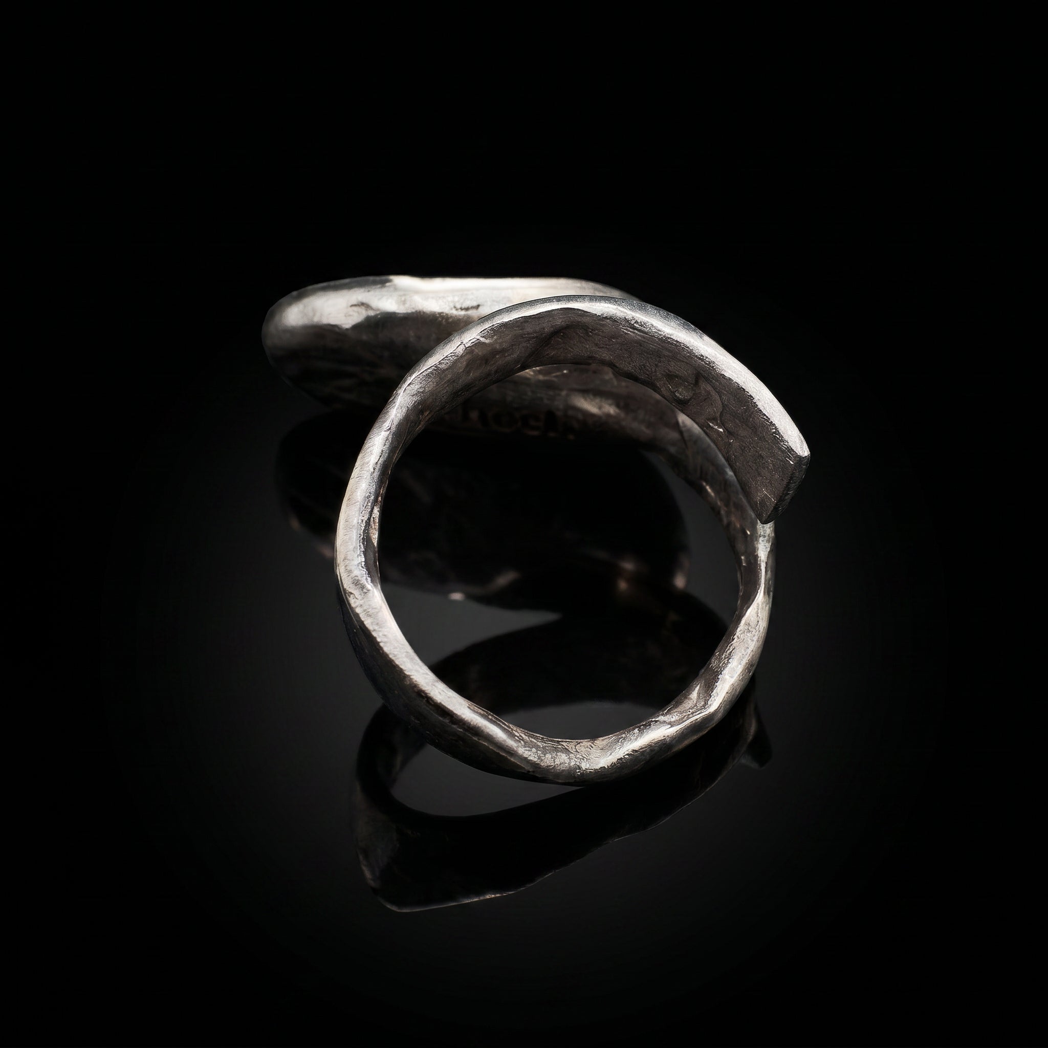 Silver-tone open oval ring band with curved silhouette