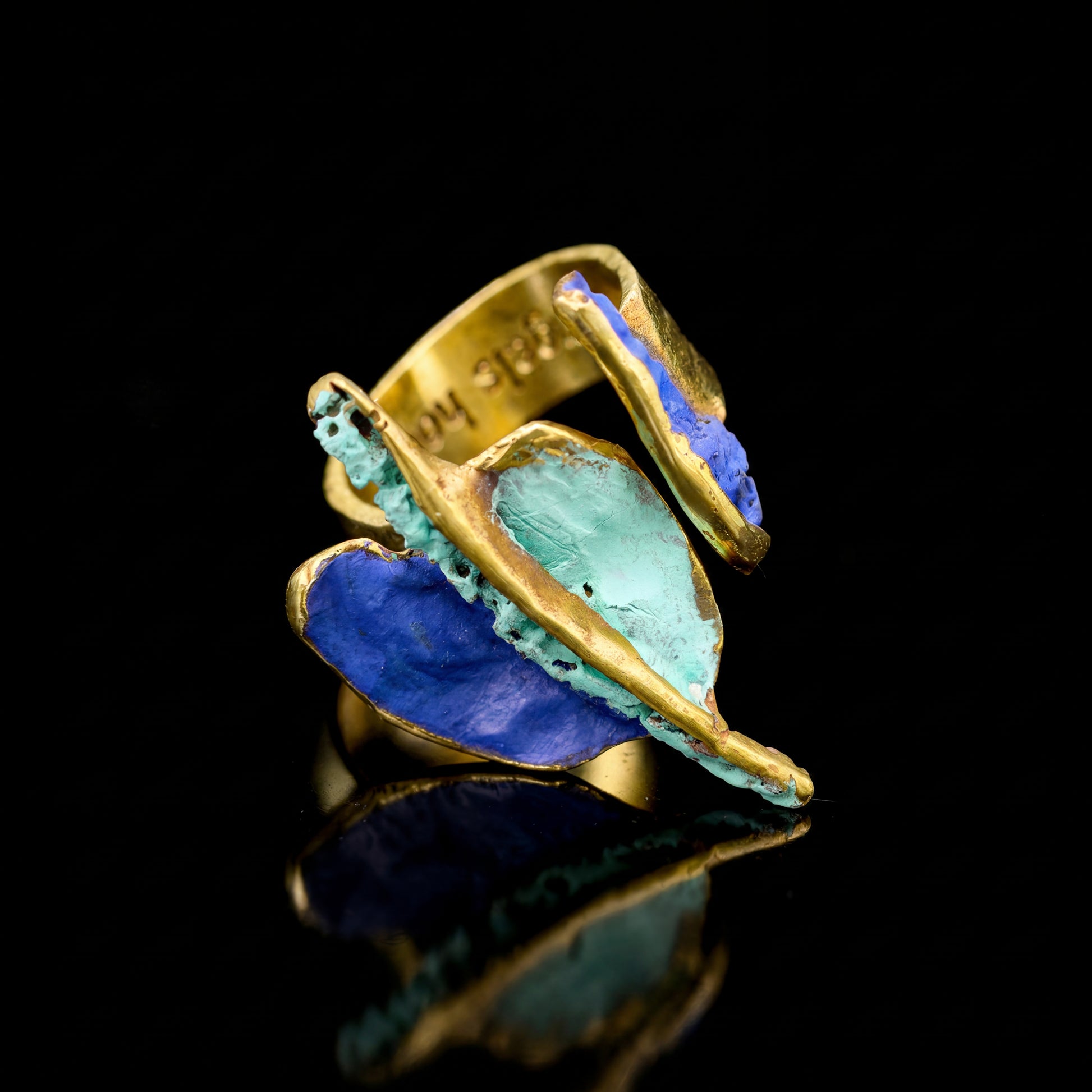 Gaudi ring with blue and turquoise inlaid stone, gold-tone frame and open shank