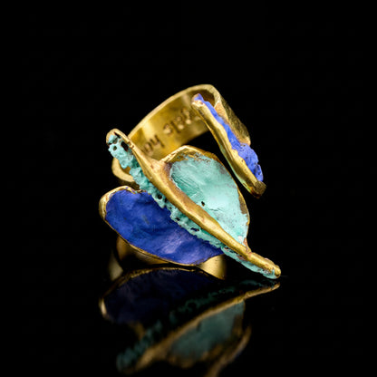 Gaudi ring with blue and turquoise inlaid stone, gold-tone frame and open shank