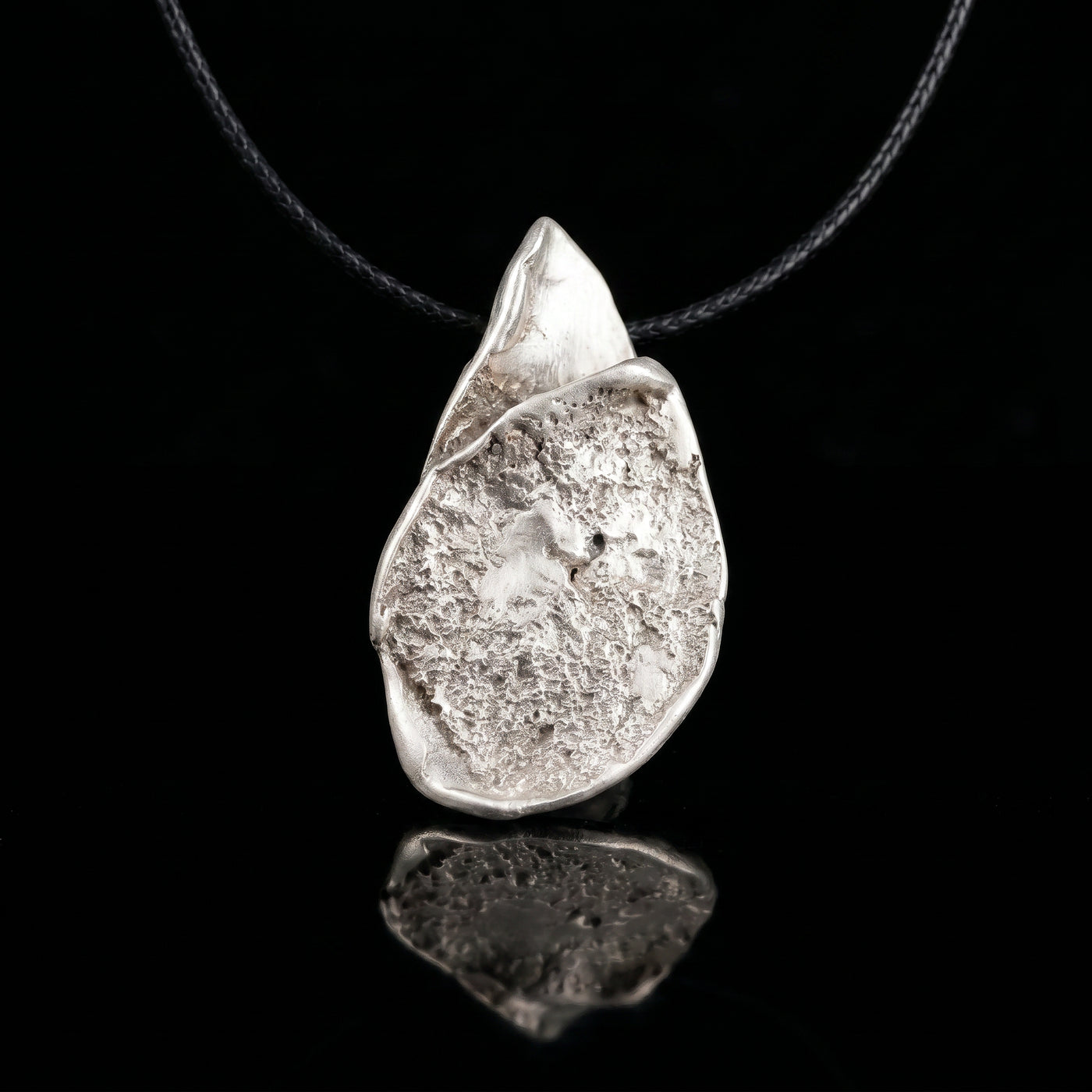 Silver-tone teardrop pendant necklace with hammered finish and loop bail