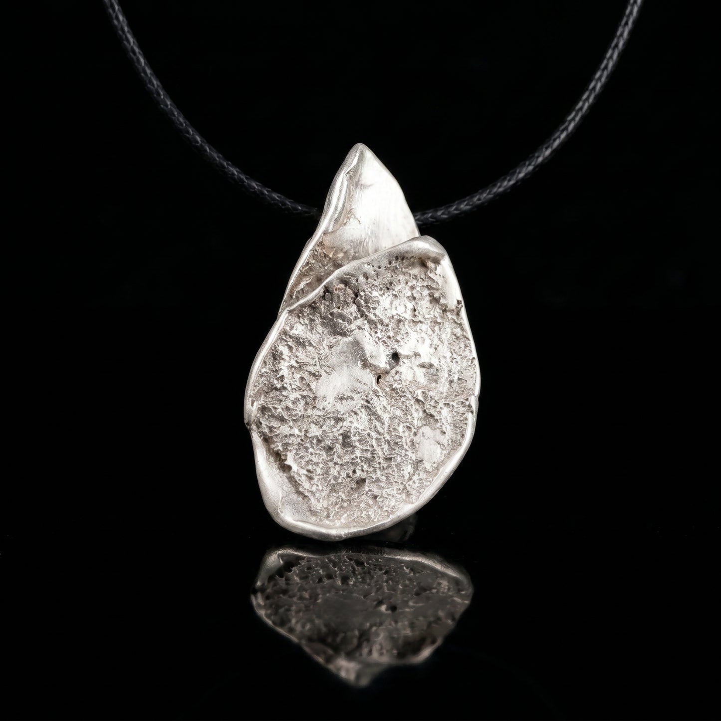 Silver-tone teardrop pendant necklace with hammered finish and loop bail