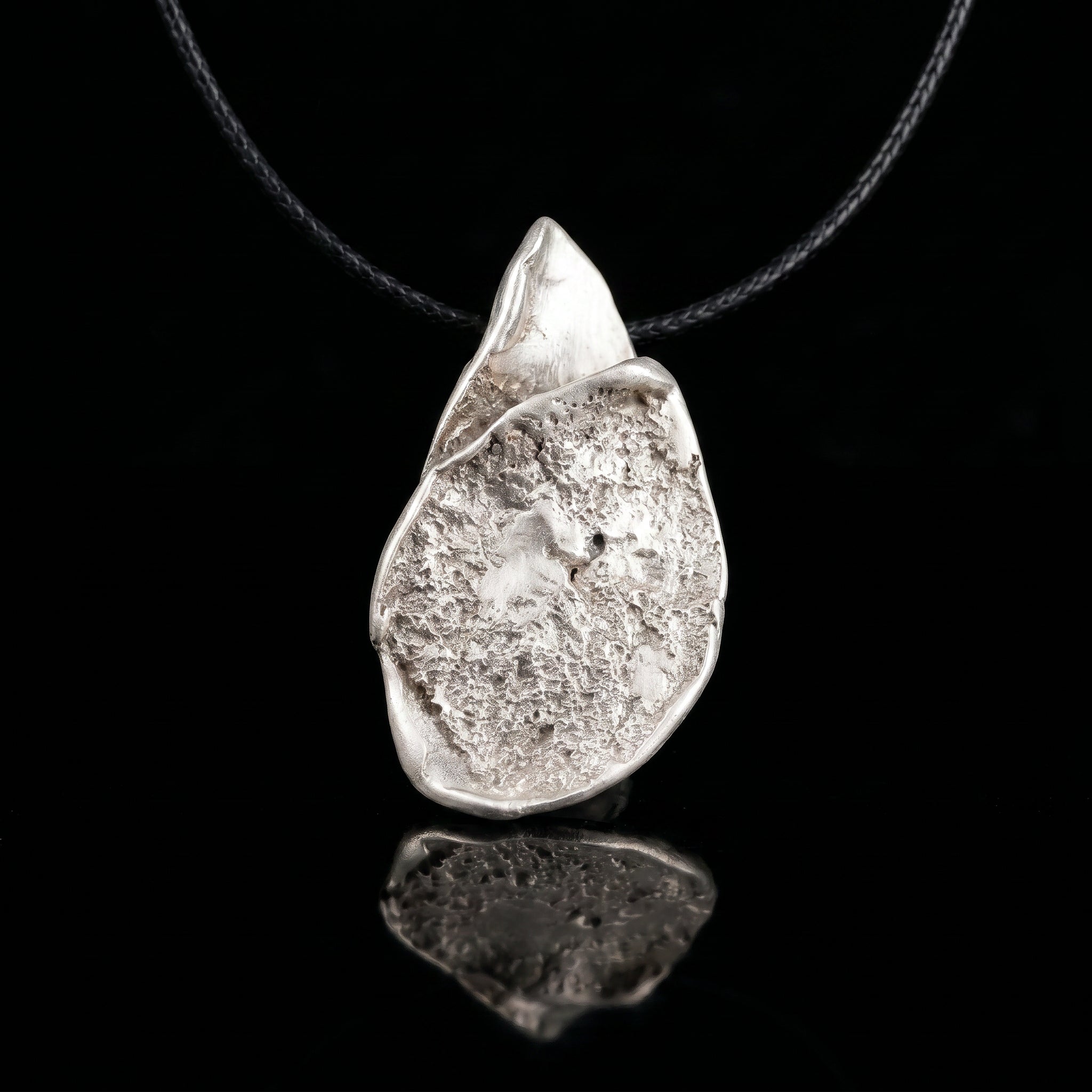 Silver-tone teardrop pendant necklace with hammered finish and loop bail