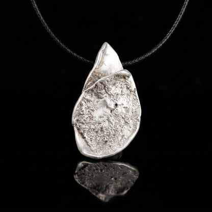 Silver-tone teardrop pendant necklace with hammered finish and loop bail