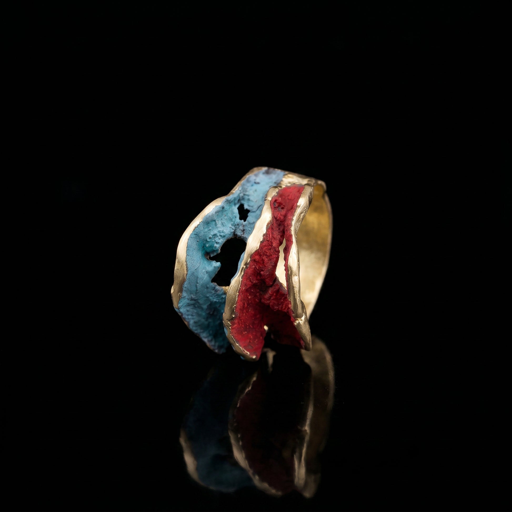 Gold-tone ring with blue and red resin inlay, textured open band