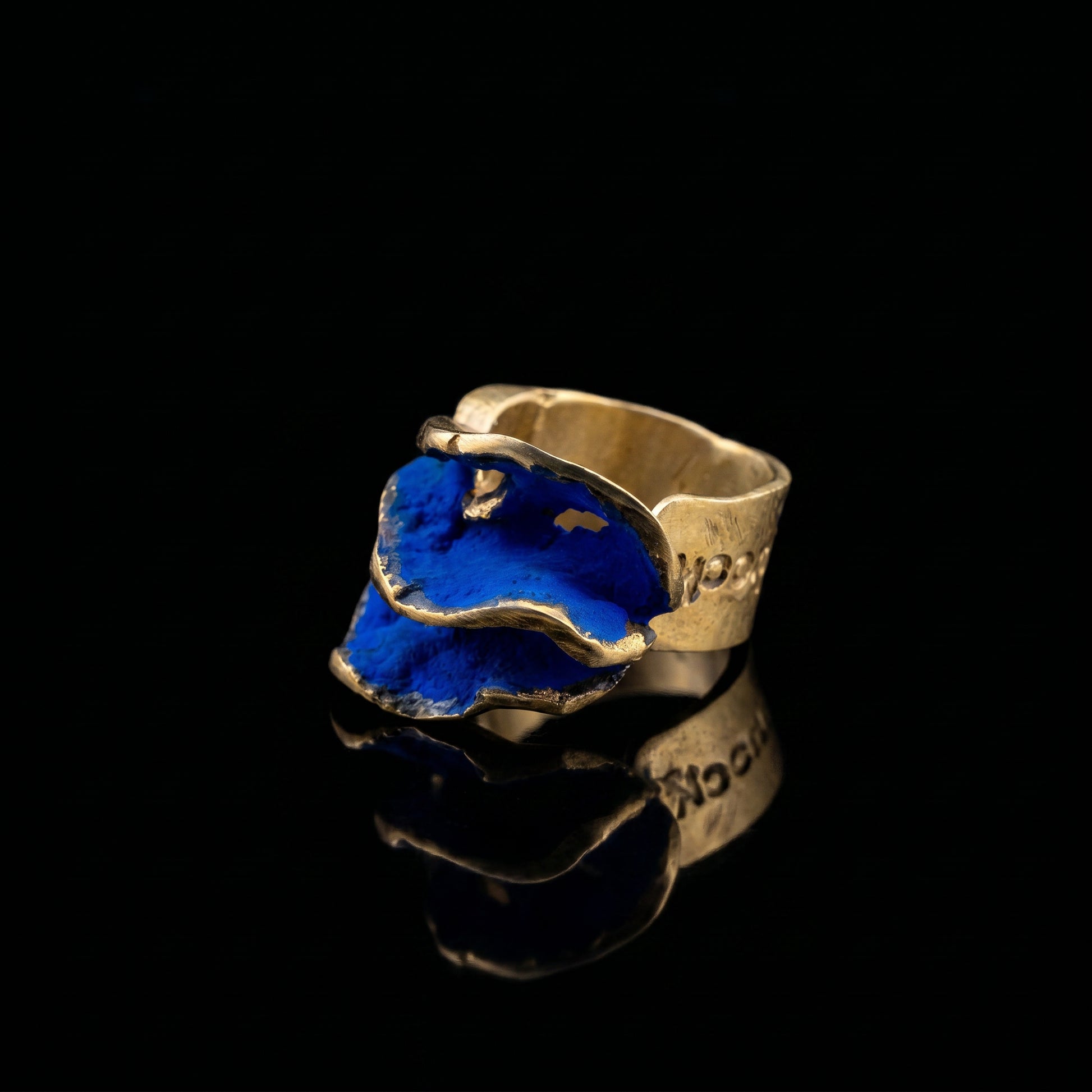 Gold-tone ring with blue resin inlay, wide hammered open band