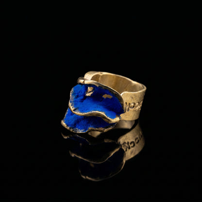 Gold-tone ring with blue resin inlay, wide hammered open band