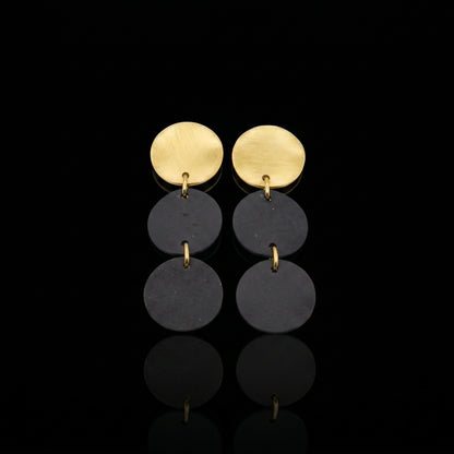 Three-disc motion earrings with gold-tone tops and two stacked dark gray discs