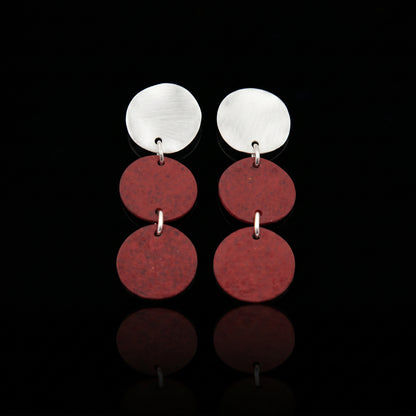 Silver-tone triple motion drop earrings with three maroon discs