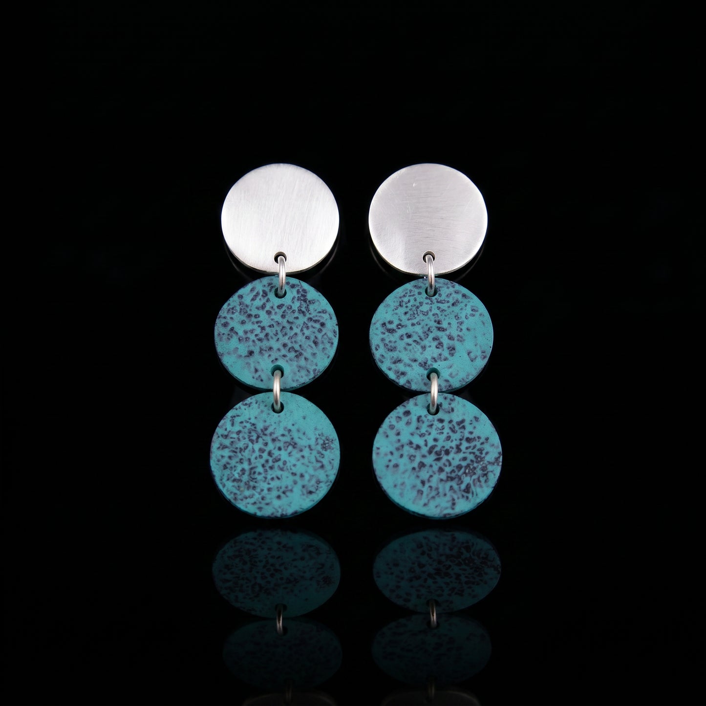 Silver-tone triple motion drop earrings with three turquoise speckled discs