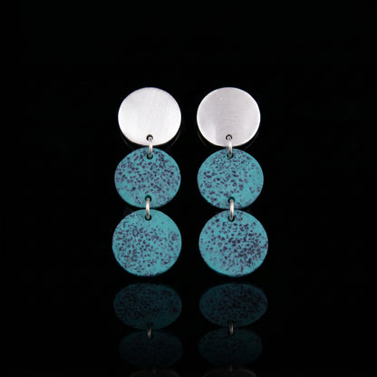 Silver-tone triple motion drop earrings with three turquoise speckled discs