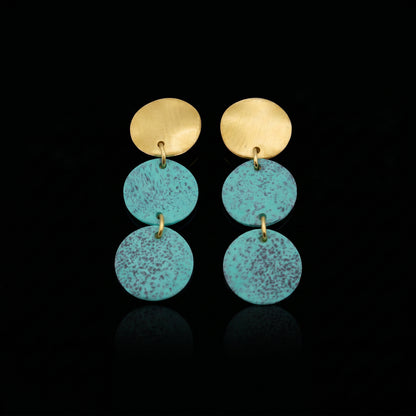 Gold-tone triple motion drop earrings with three turquoise speckled discs