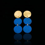Arracades de triple moviment daurades amb tres discs blaus