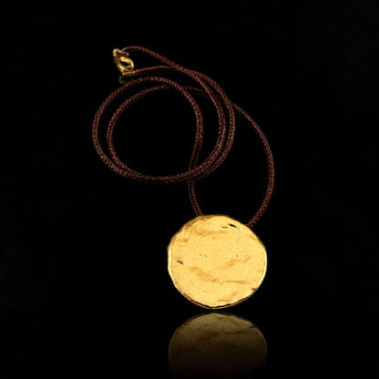 Gold round disc pendant necklace with brown cord and small clasp