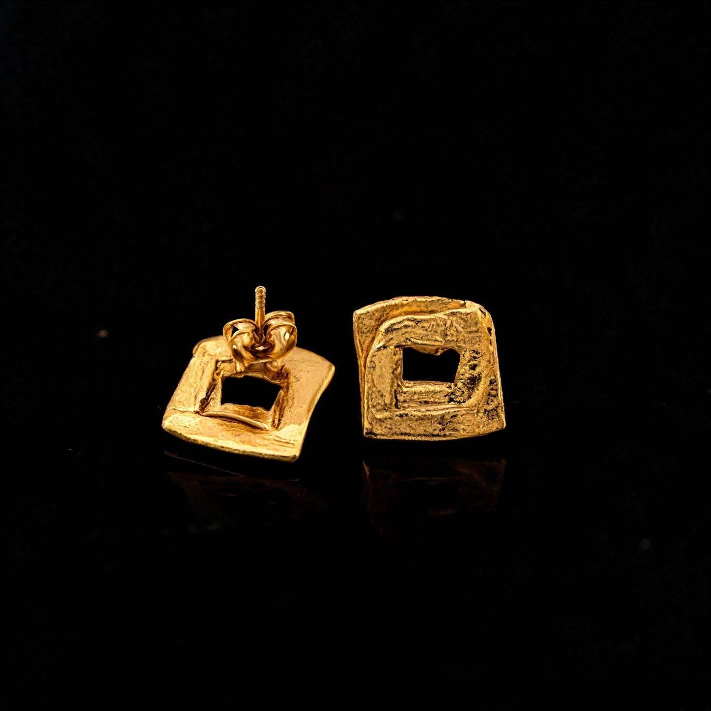 Gold square frame stud earrings with hollow center, side view