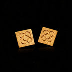 Gold square flower stud earrings with embossed quatrefoil pattern