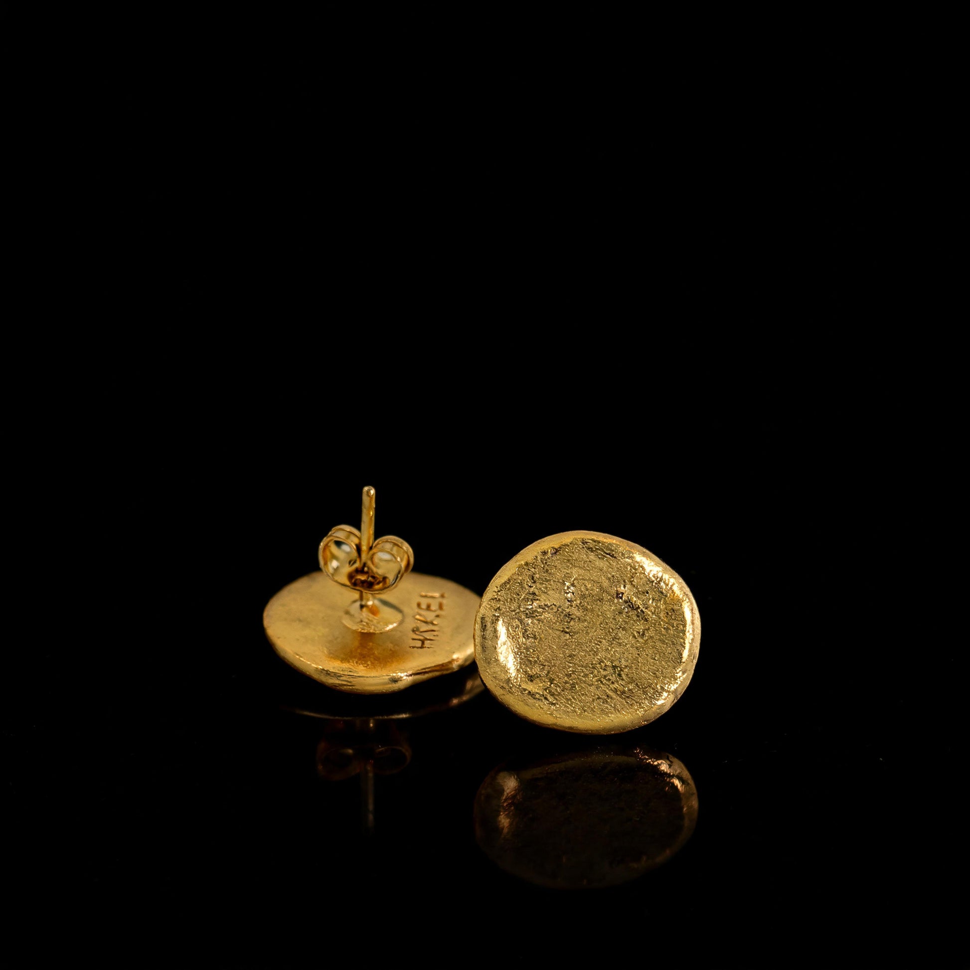 Gold round stud earrings with delicate post and small circular back