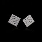 Silver square flower stud earrings with embossed quatrefoil pattern