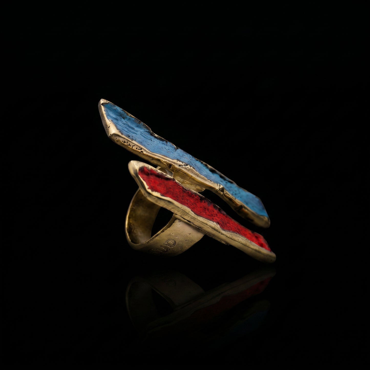Gold-tone ring with long oval bezel, blue-turquoise and red enamel inlay