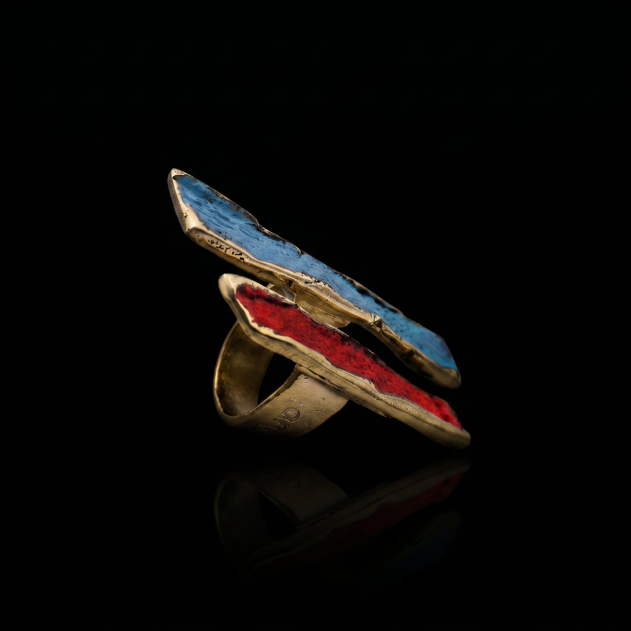 Gold-tone ring with long oval bezel, blue-turquoise and red enamel inlay