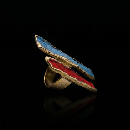 Gold-tone ring with long oval bezel, blue-turquoise and red enamel inlay