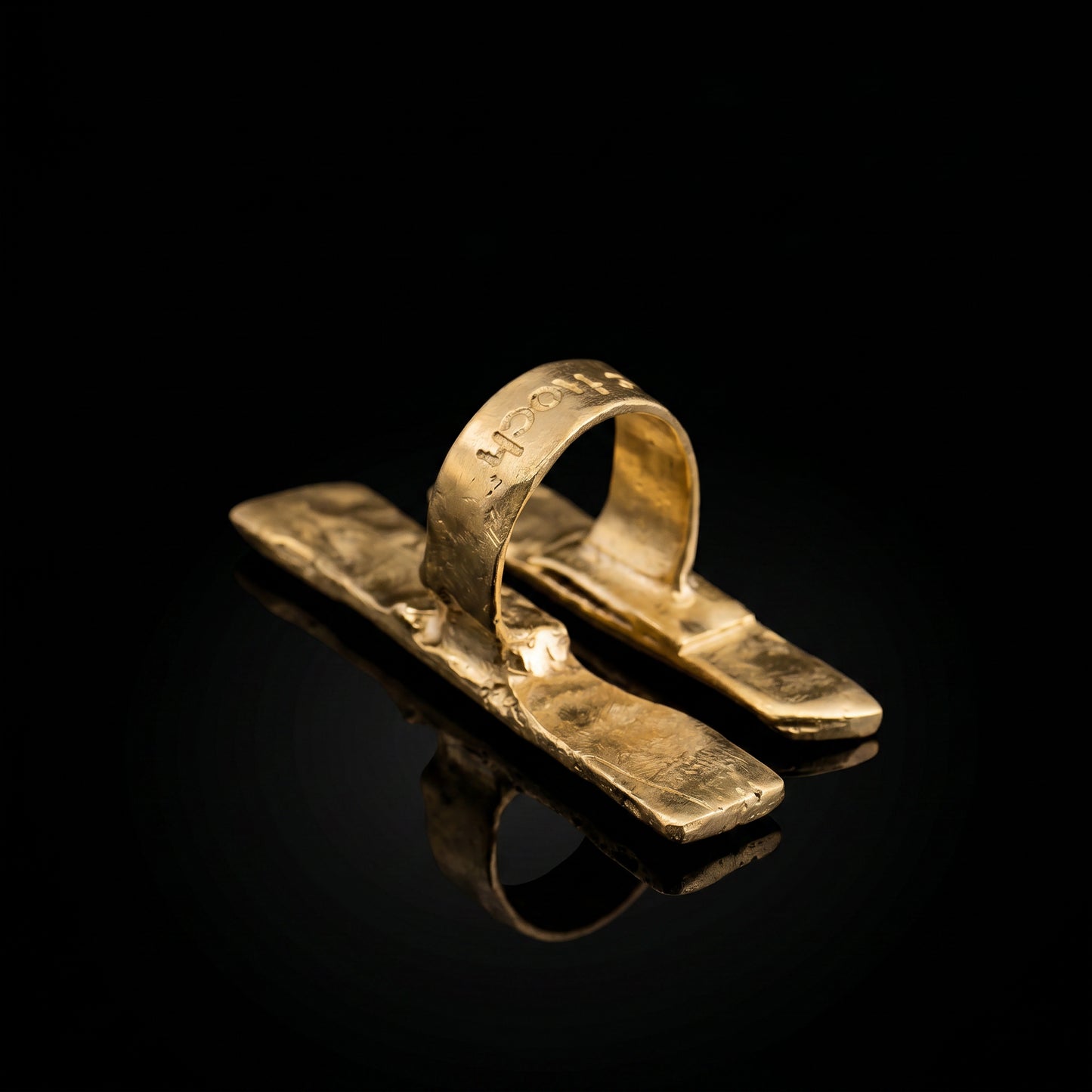 Hammered gold-tone ring with open split band and raised bar centerpiece