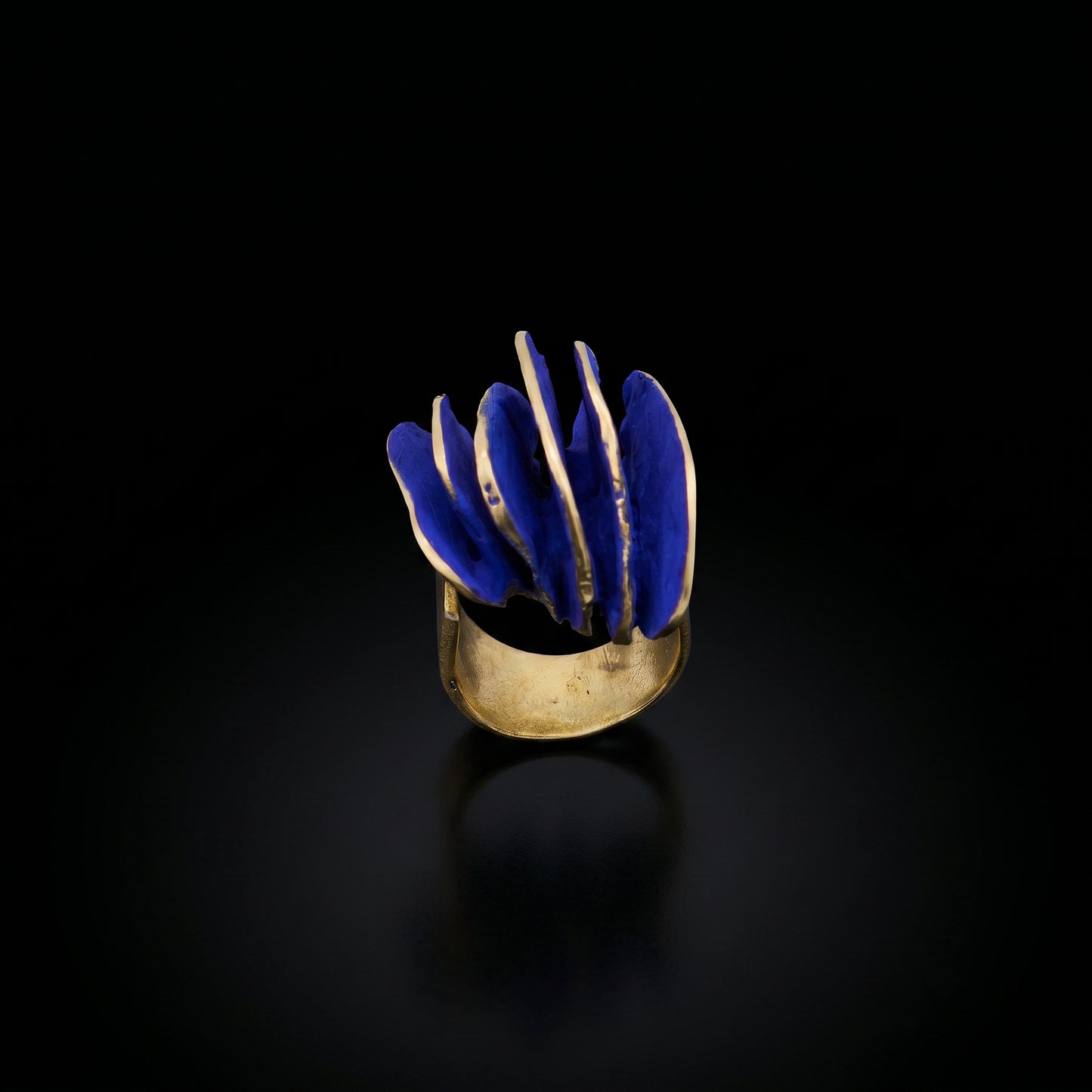 Gold-tone ring with blue wave inlay, front view