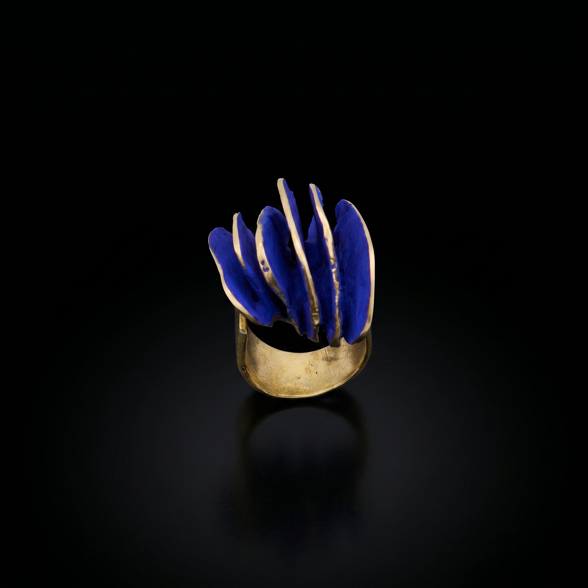 Gold-tone ring with blue wave inlay, front view
