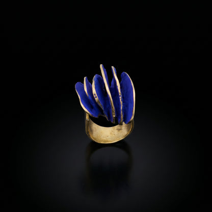 Gold-tone ring with blue wave inlay, front view