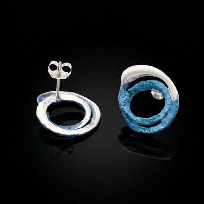 Two-tone trace hoop earrings: blue ring and silver ring with posts