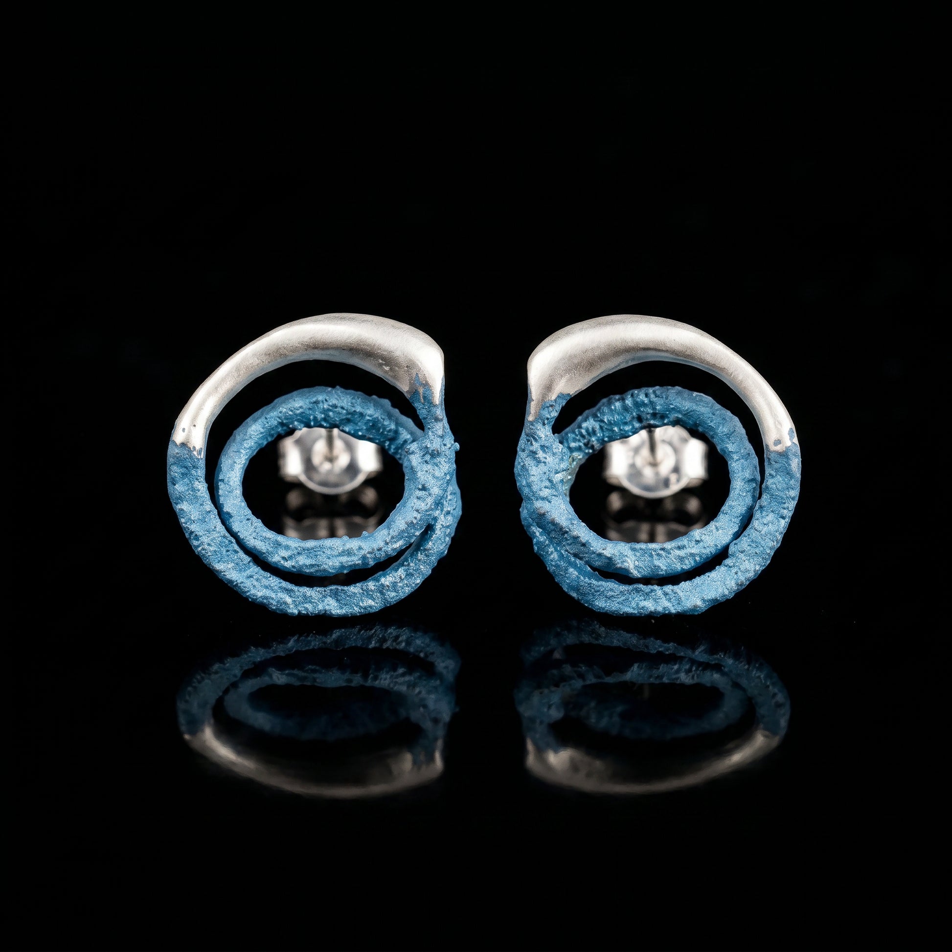 Trace hoop earrings with blue textured rings and silver posts