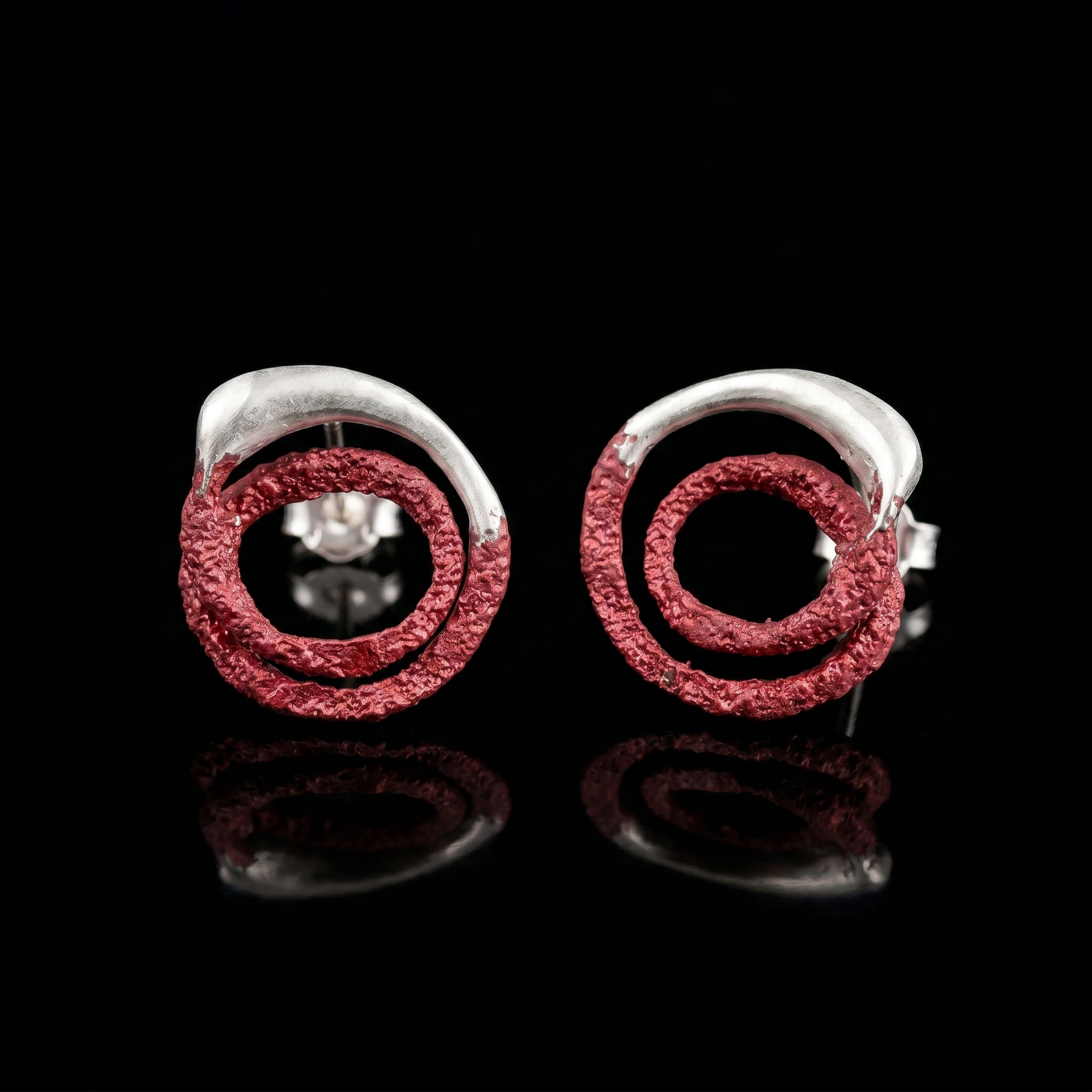 Trace hoop earrings with red textured rings and silver posts