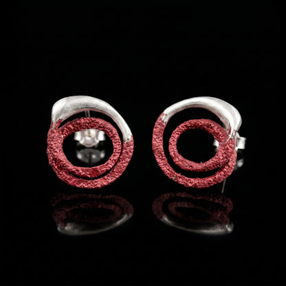 Trace hoop earrings with red textured rings and silver posts