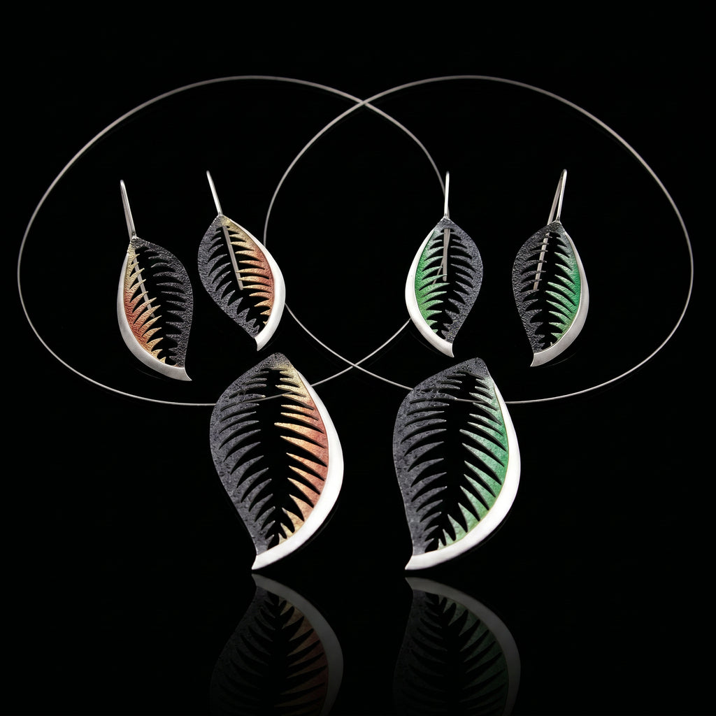 Set of veined leaf earrings in black, orange-brown, and green with silver-tone hooks.