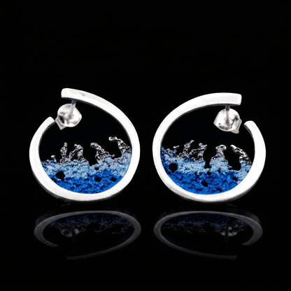 Silver hoop earrings with blue resin splash design