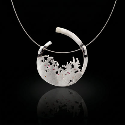 Silver 925 pendant with teardrop bezel and pale textured inlay with dark speckles