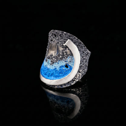 925 ring with textured silver band and blue ocean swirl inset, side view
