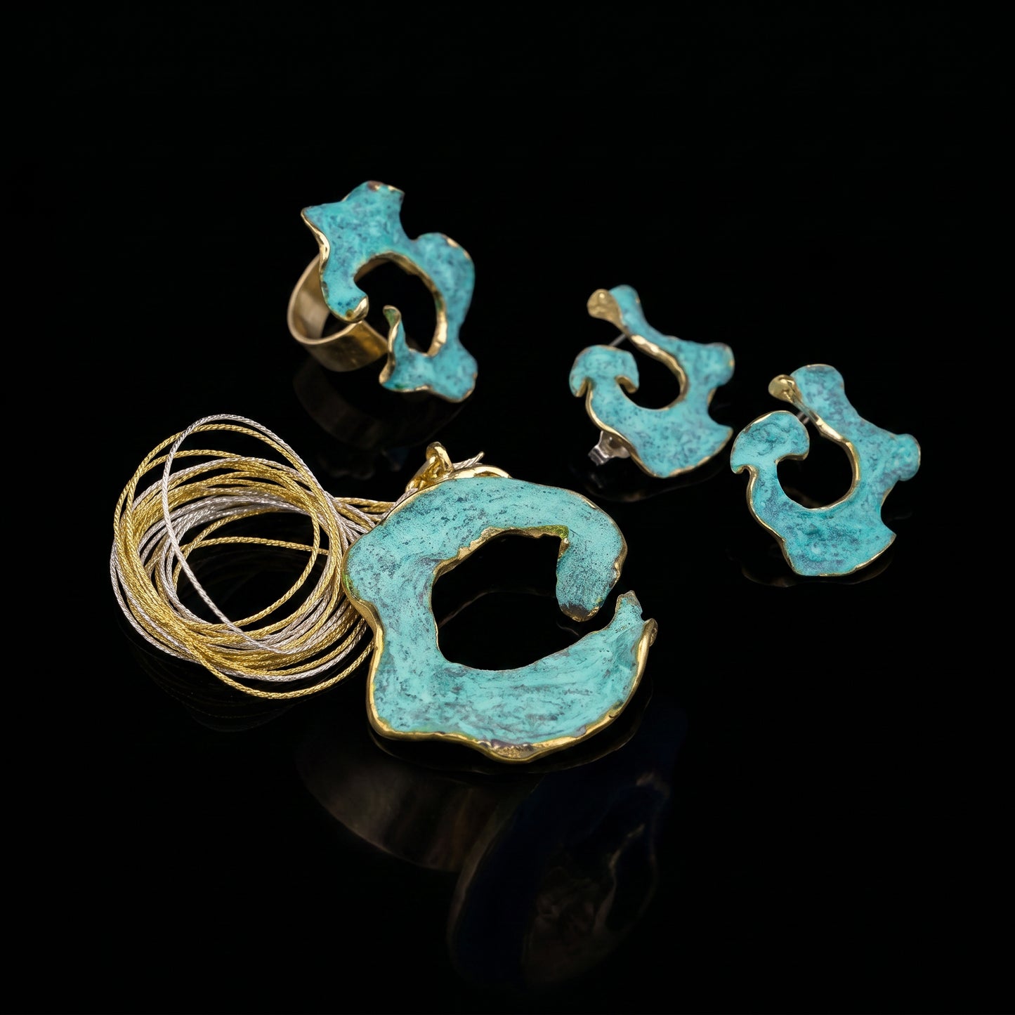 Eterna C turquoise enamel earrings with gold-tone edging, sculpted openwork pieces
