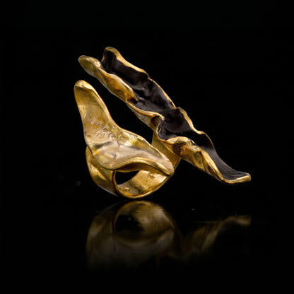 Gold-tone wave ring with dark back enamel and raised wave design