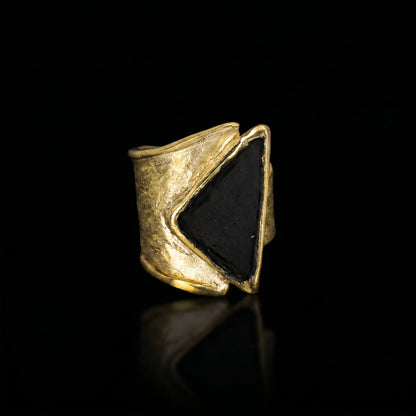 Gold tone triangle-stone ring, side view with dark triangular inset