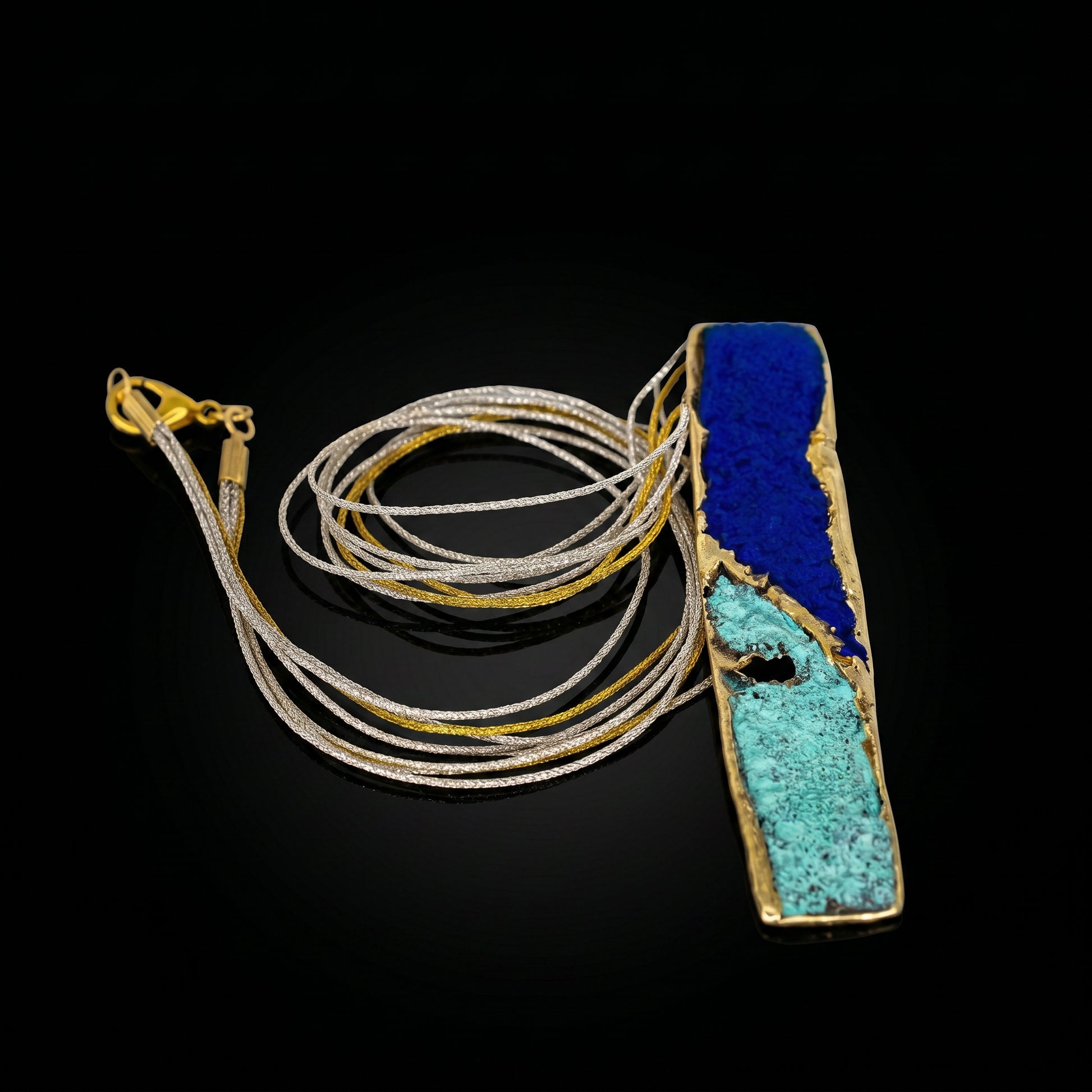 Blue and turquoise pendant necklace with rectangular stone and gold-tone chain strands