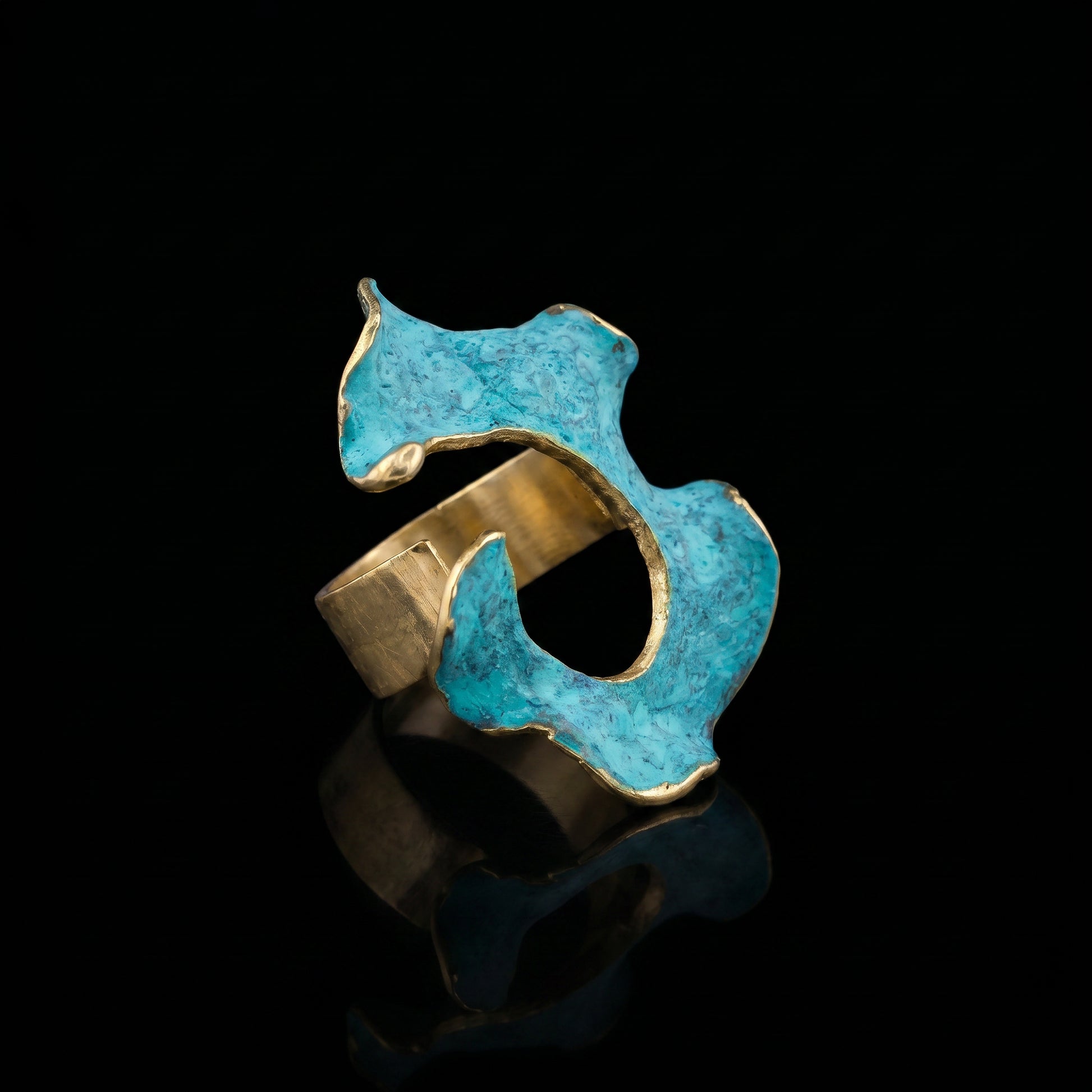 Turquoise and gold openwork statement ring with an irregular cutout window.