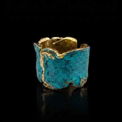 Gold-tone cuff ring with turquoise-blue textured band