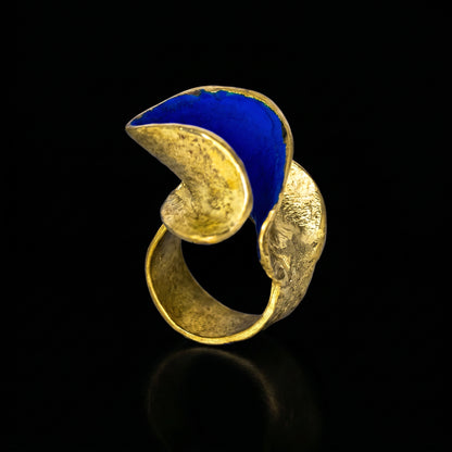 Gold and blue statement ring with oval blue inlay
