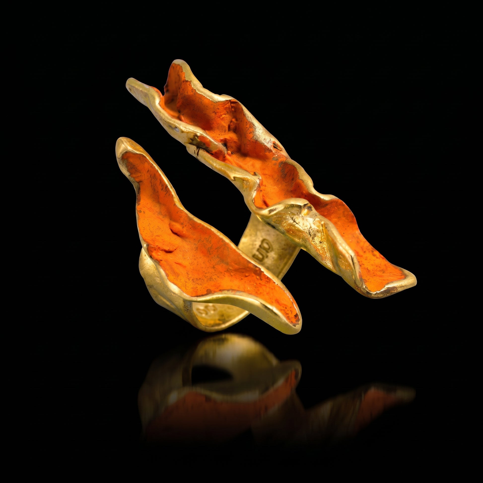 Orange wave ring with gold-tone setting and textured enamel wave shape