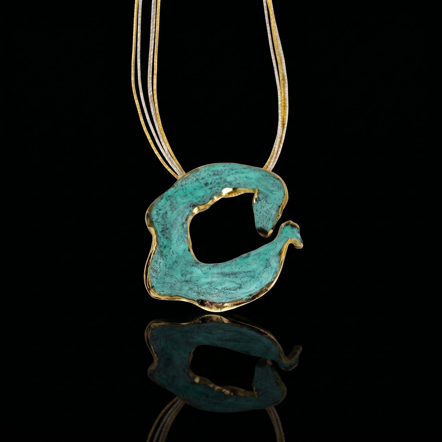 Turquoise C pendant with gold-tone edging and chain
