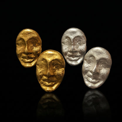 Four textured oval face earrings in gold and silver tones