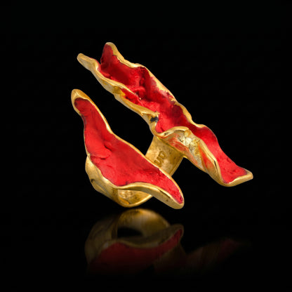 Red wave ring with gold-tone setting and raised enamel wave pattern